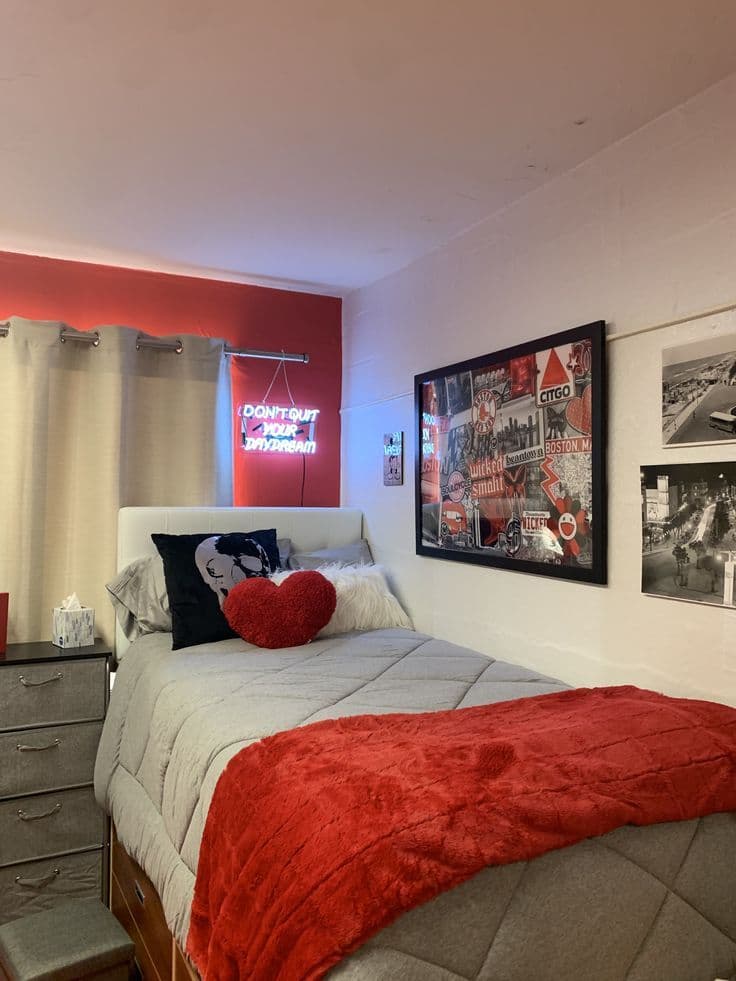 Room with cherry red pillows and neon sign